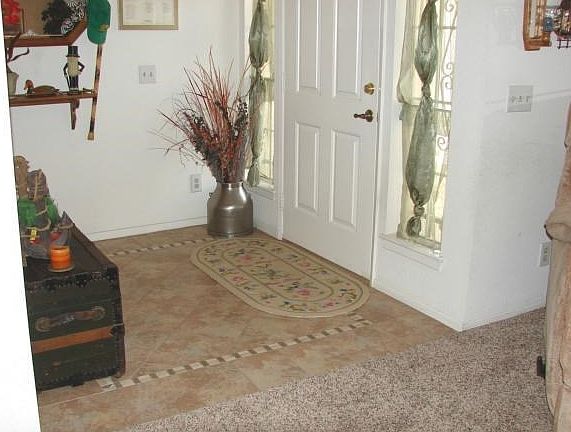 TILED ENTRYWAY, 6 PANEL DOORS THROUGHOUT HOME, NEWER FLOORING TH