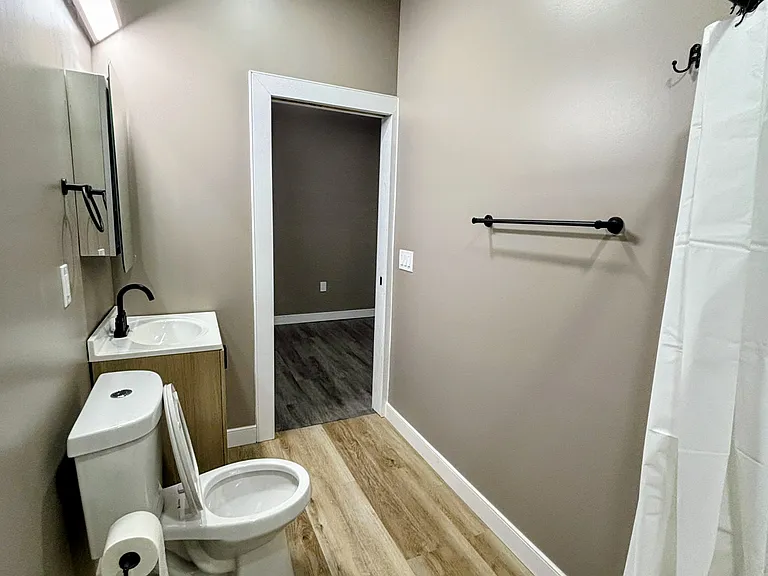Nice size bathroom with all new fixtures 24x28 tiles in shower. Great lighting