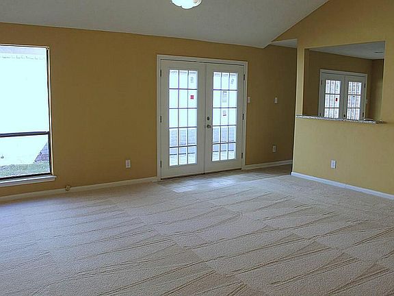 Please notice the wonderful Breakfast Bar w/granite & the many windows bringing life to this space!