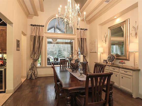 Tiered barrel ceilings plus built in buffet! Gorgeous wood floors and adjoining Butlers pantry with Wine Refrigerator!