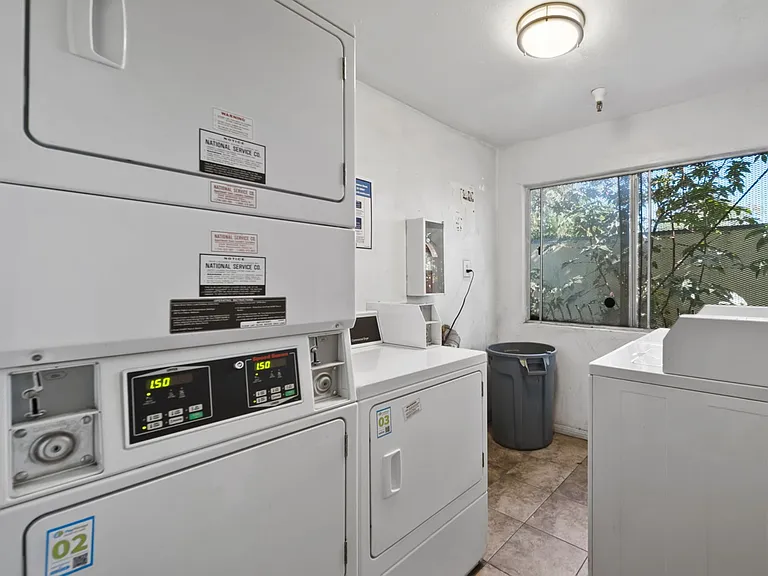 Convenient on-site laundry facilities featuring multiple washers and dryers.