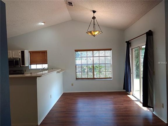 Dining room provides sliding glass door access out to the patio