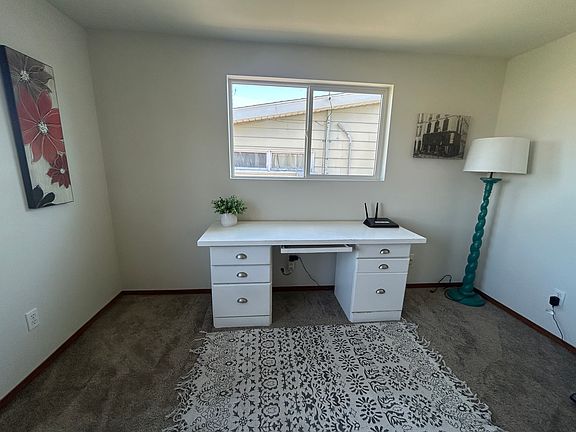 Office space off entry and dining table