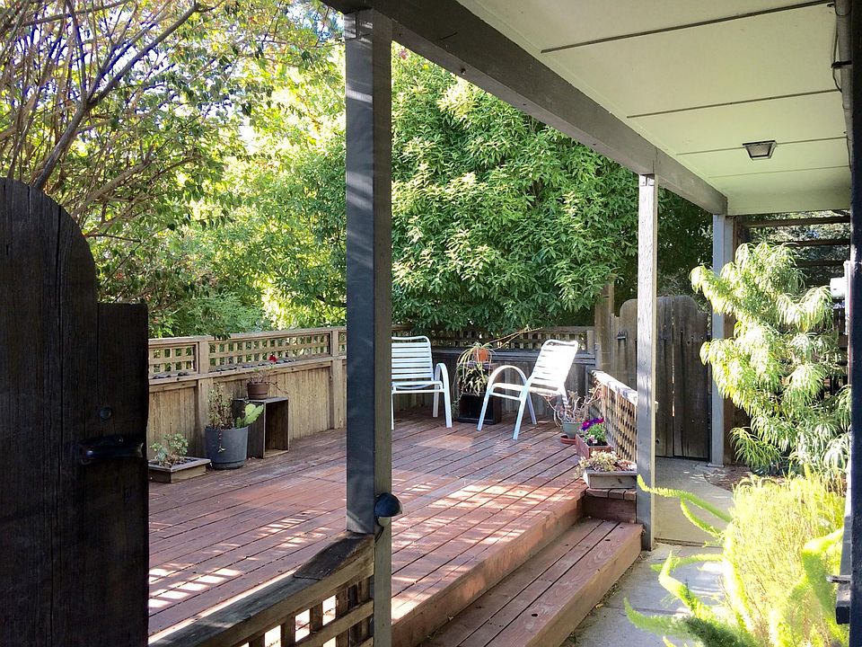 View as entering unit from parking area, including private deck.