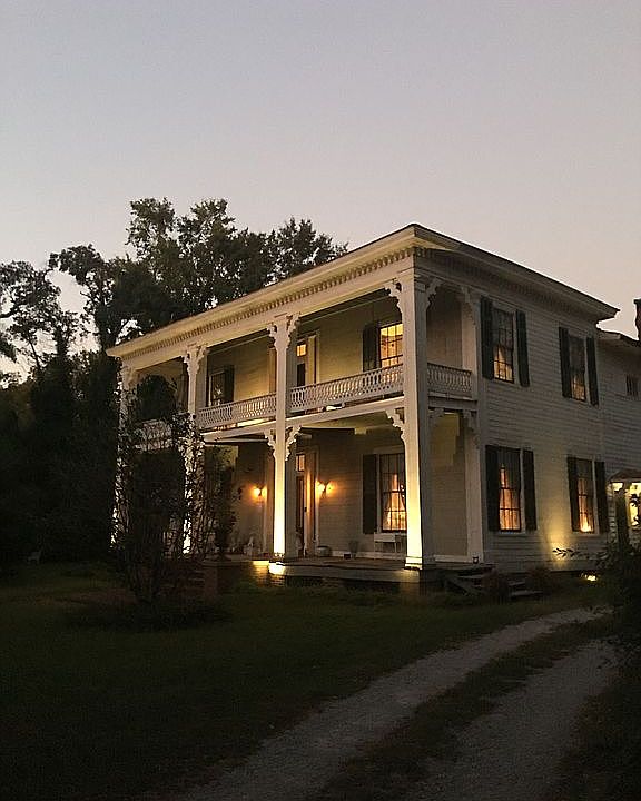 West facade of house at dusk