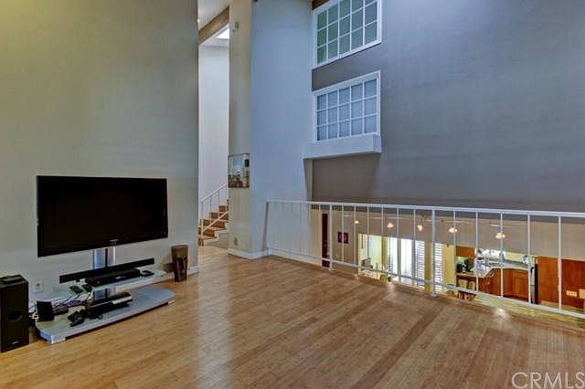 Huge living room with artistic vibe and vaulted ceilings