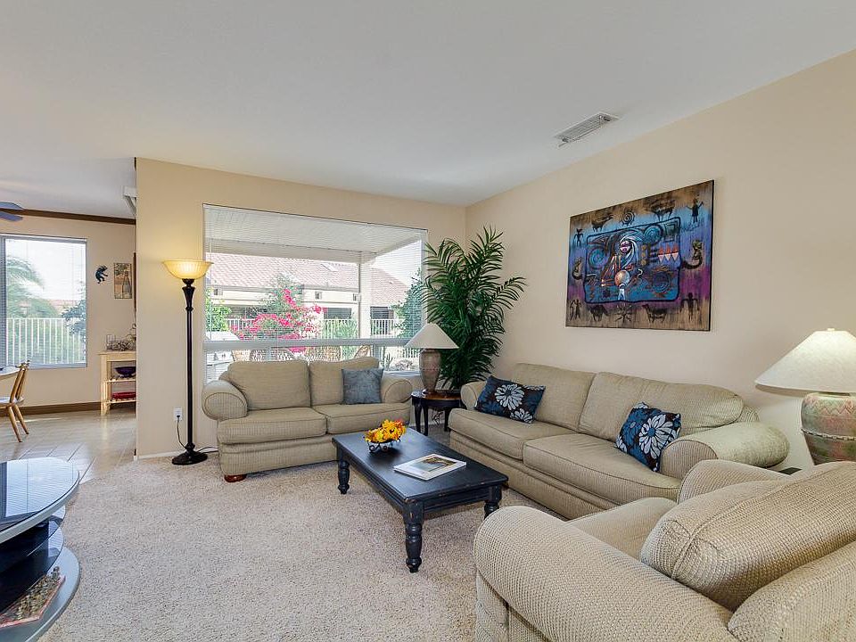 Living room photo was taken before new laminate flooring was installed and painting throughout