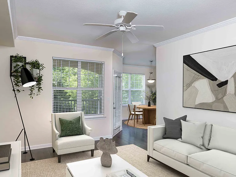 Living room with crown molding and ceiling fan
