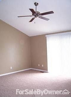 Living room with vaulted ceiling.
