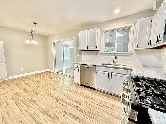 kitchen with eat-in area, leading to sunroom