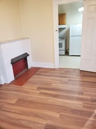 Large, bright front bedroom 1 with decorative fireplace