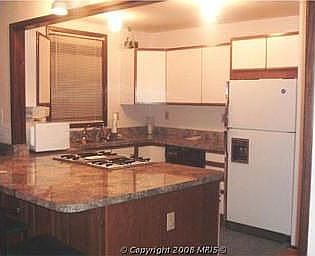 Open kitchen area to family room