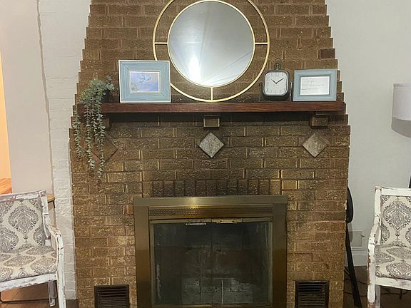 Rustic fireplace and hardwood floors (fireplace is non-functioning)