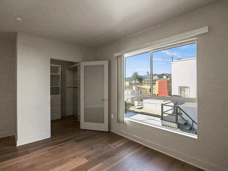 Bedroom with Walk-In Closet with Built-In Organizers