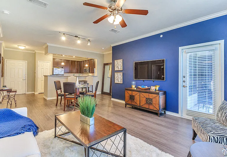 Large Living Room with open concept kitchen and ceiling fan