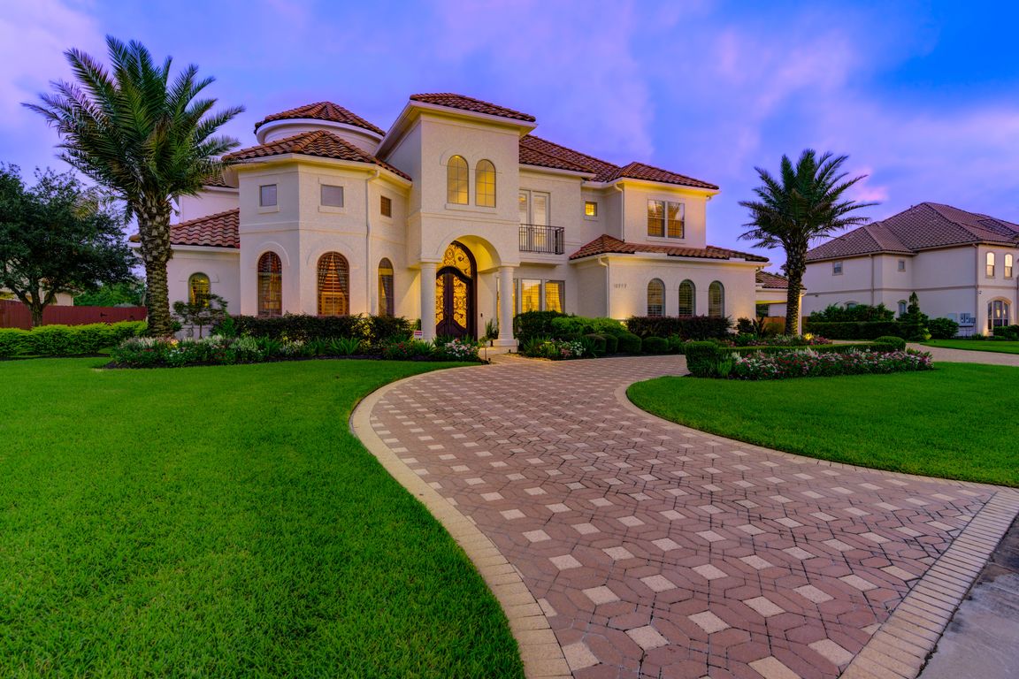 Commanding and sophisticated, the front elevation of this Kickerillo Signature estate radiates timeless curb appeal with a blend of classic architectural details and modern elegance.