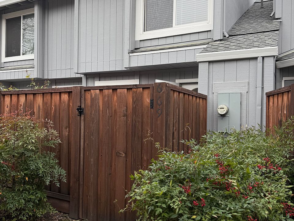 From covered parking area to entry gate to private front patio and front door to unit.