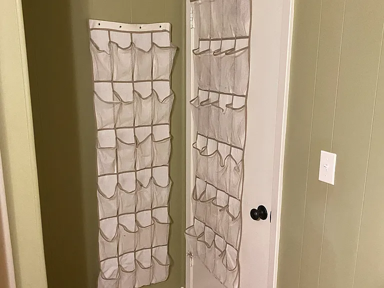 (5 of 5) Guest bedroom shoe storage.