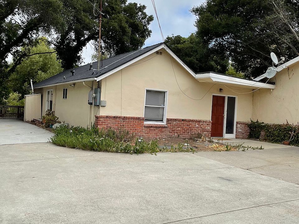 Front view of house with side parking