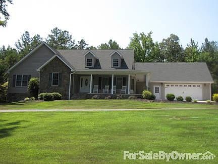 Front Exterior
						:
						with paved circle drive and wrap around porch!