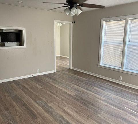 From the front door looking at living room into dining room doorway and kitchen pass through