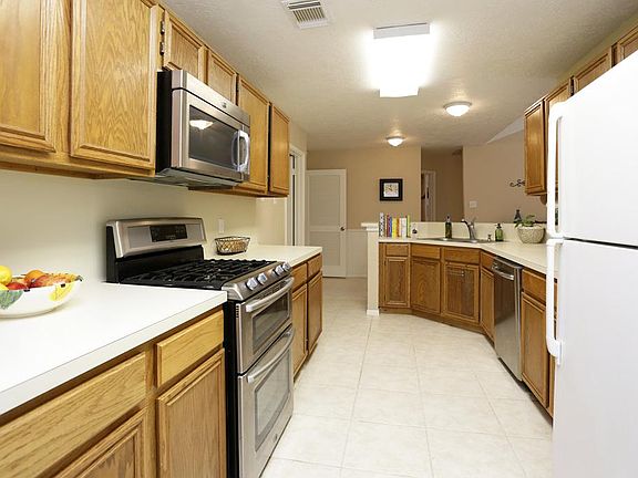 View of Kitchen with recently installed Stainless Double Oven and microwave, 2012/ Owners! Ceramic Tiled Floor!