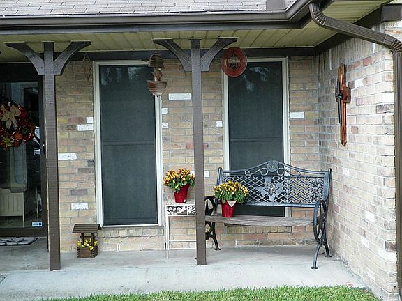 Covered front porch is big enough for a bench and a table or just some pretty plants.