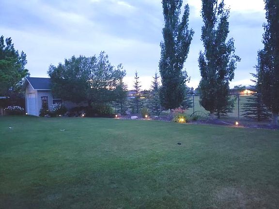 Fully fenced backyard with storage shed