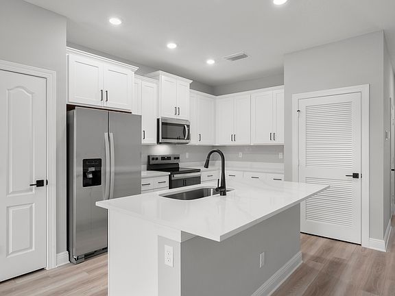 The dining area and kitchen are open concept, making hosting a breeze