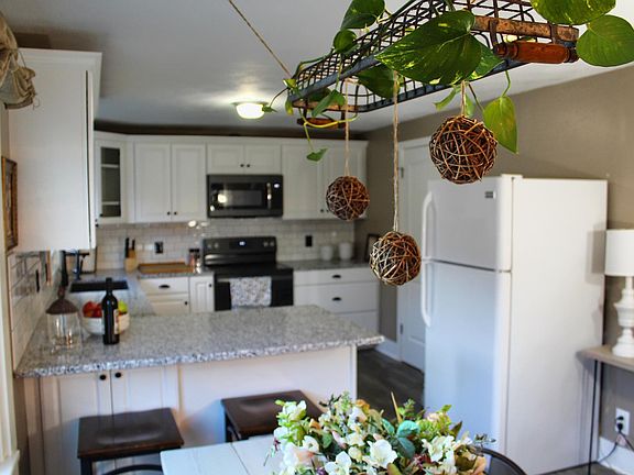 Open concept from kitchen to dining room with breakfast bar