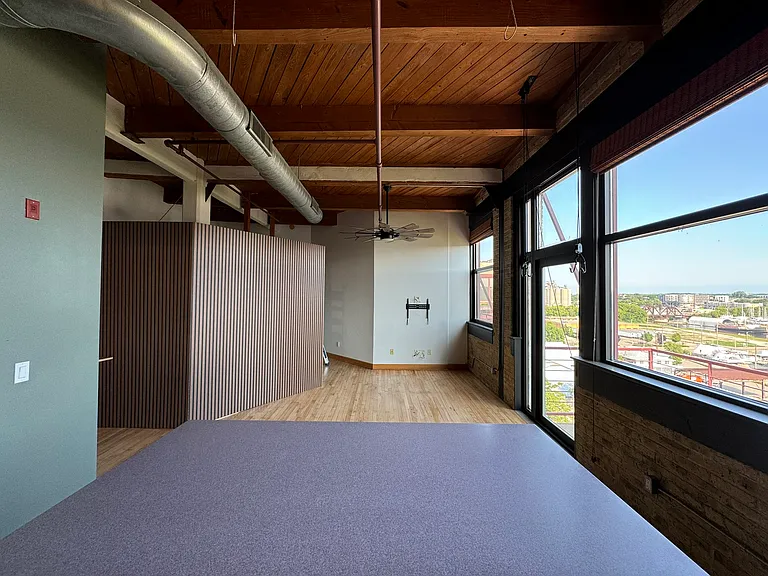 Open concept kitchen and living room. Ceiling fan with light and remote control
