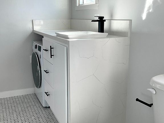 Marble Waterfall Counter Top in Fully-Remodeled Bathroom