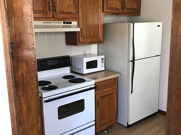 Kitchen pic with furnished stove, microwave, dishwasher and refrigerator!