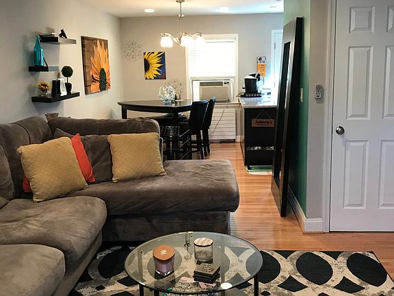 living room from the front window and door where laundry mac