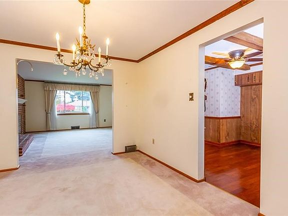 Dining room.  Carpet is custom designed but there are hardwoods under the carpeting through out the main floor.