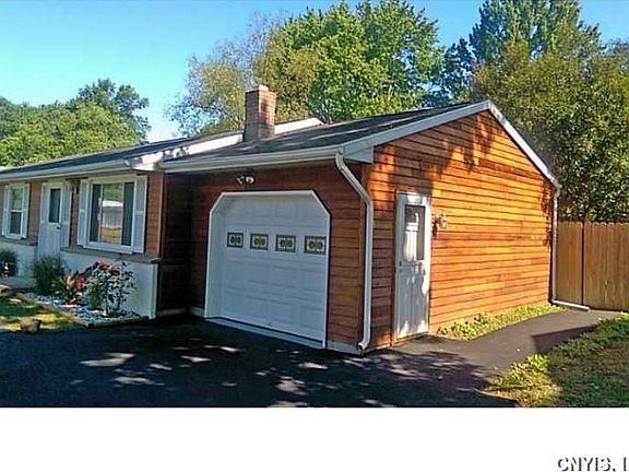Exterior Front. Garage with light sensor at night.