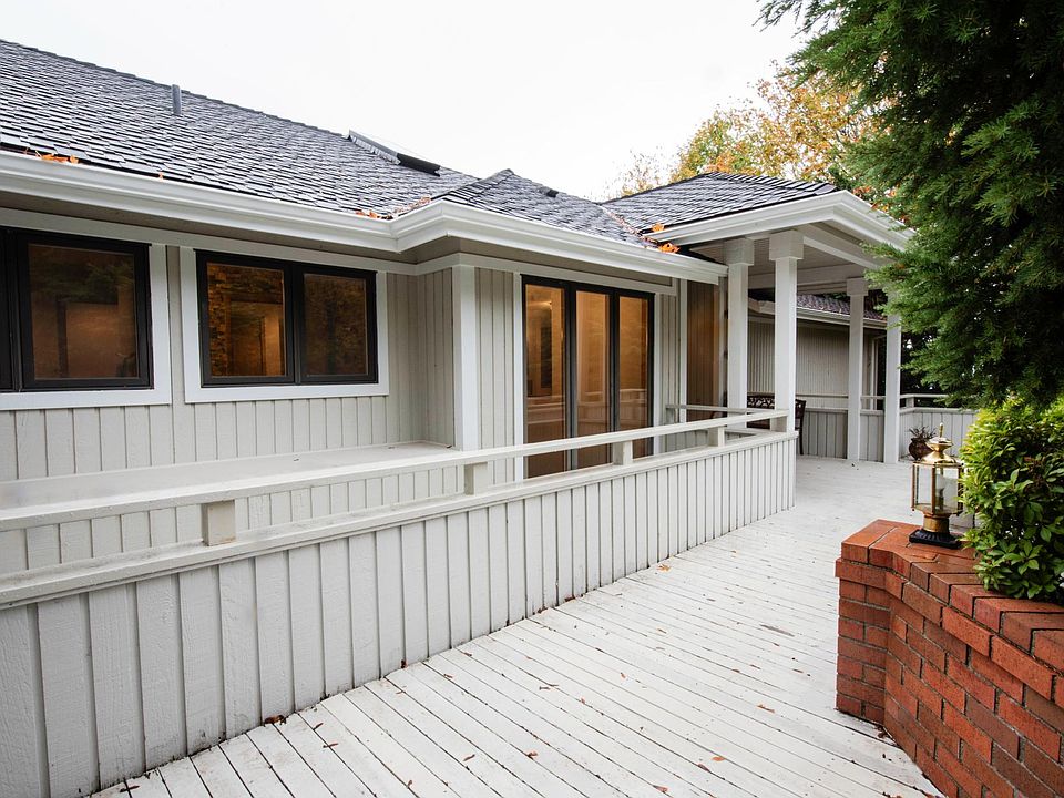 Front porch leading to the grand entrance of the house.