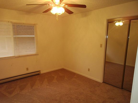 Second bedroom with mirror closet doors