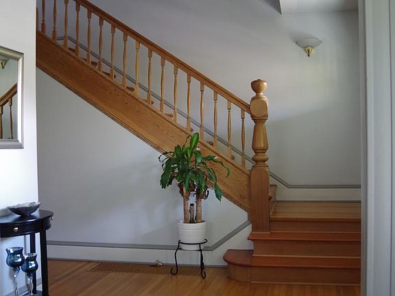 Stairway to upstairs from entry hall.