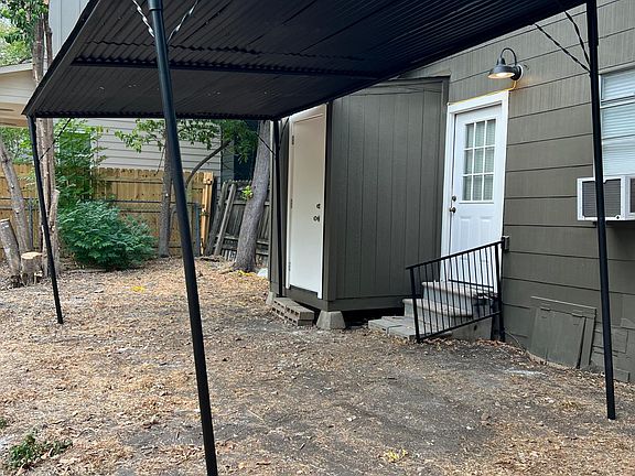 Covered back yard patio. Utility Room with washer/dryer
