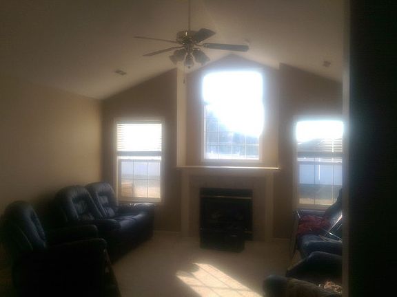 Family room
						:
						Vaulted ceiling, gas fireplace, and large windows.