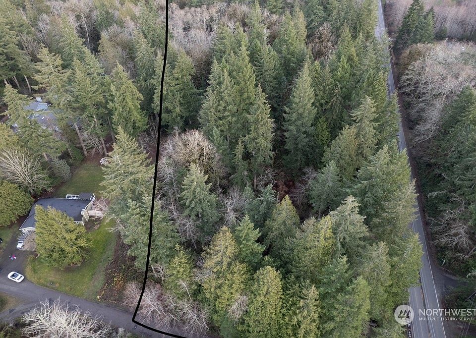 On the North side of Sedgwick - 4.57 acres. Corner lot with established 30' easement in nice neighborhood of homes on acreage.  Close to the Southworth for commuters! Property building site on the Western area gives the most level areas. There is a year round creek with land sloping to the water on both sides.  The East side of land could be accessed with a driveway. Nice land with tall evergreens.>