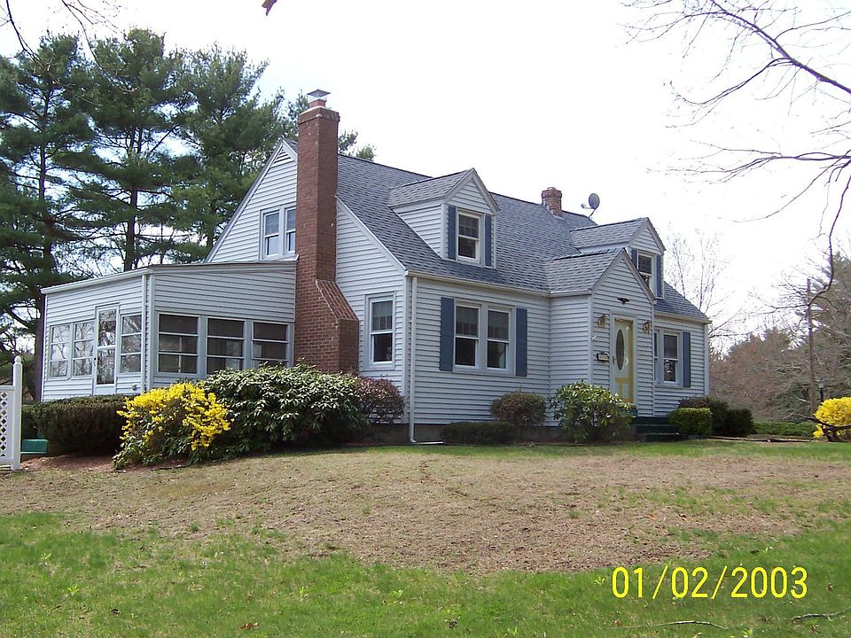 Front View of home with Sun Room on left end.