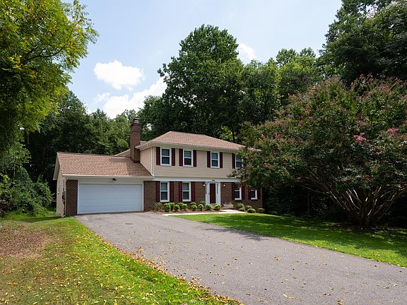 Wide driveway offers plenty of parking.