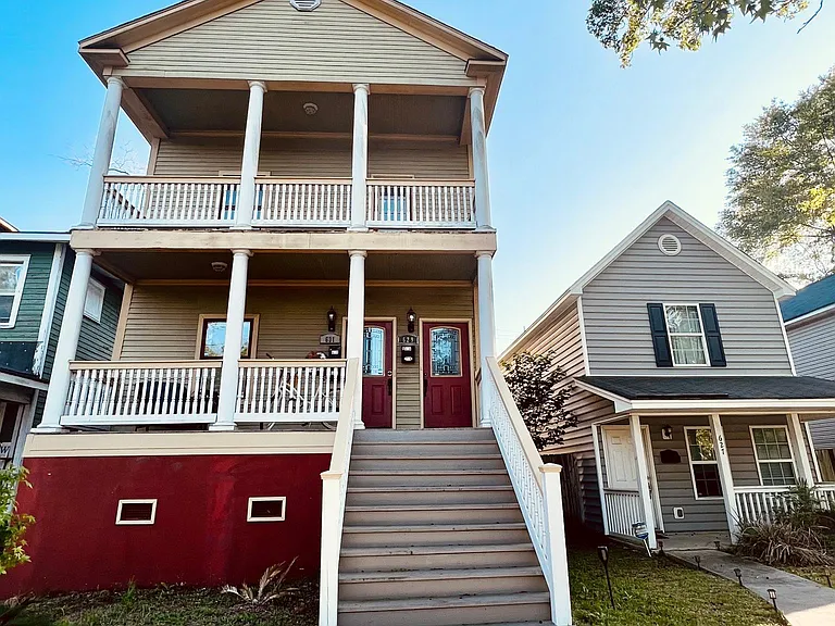 Building exterior. The unit is on the top floor of this classic Savannah two-story home.