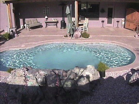 extended patio across back with door off family room and master bedroom