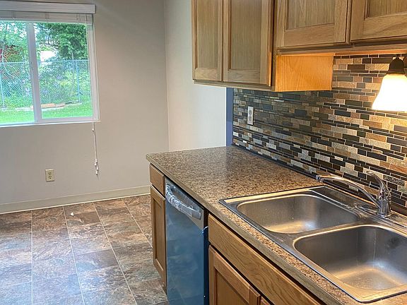 Beautiful kitchen with lots of storage space, room for eating area by window.