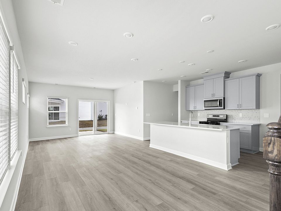 The kitchen overlooks the dining area and great room.