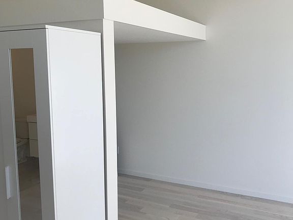 Sleeping alcove area with storage loft above