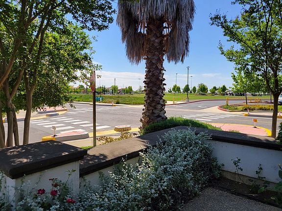 Overlooking the 20 acre Heron Landing park with water splash pad, soccer field, tennis courts, basket ball court and gorgeous bike and walking trail